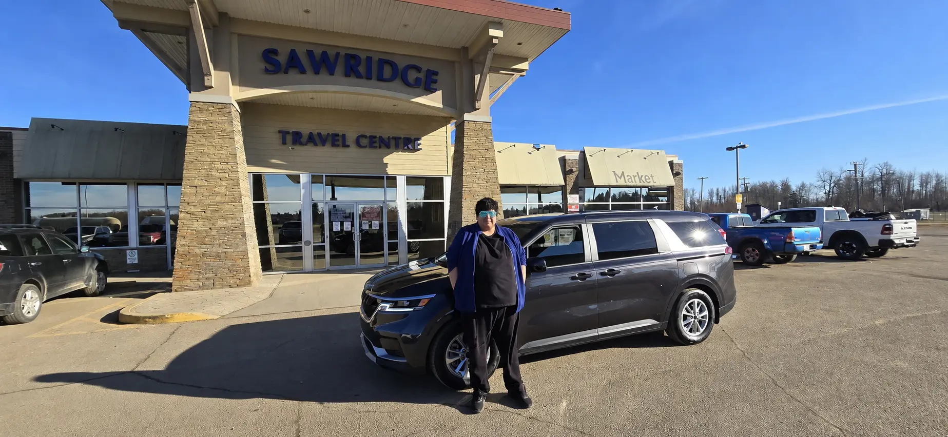 A customer with a grey SUV at a northern travel centre