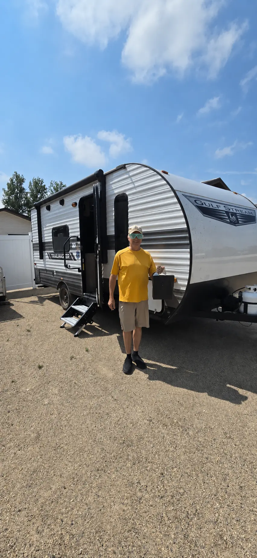 A customer stepping out of his new travel trailer